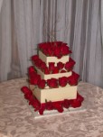 Wedding cake decorated with red roses